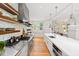 Modern kitchen with stainless steel appliances and white cabinetry at 805 Pinehurst Dr, Chapel Hill, NC 27517