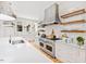 Modern kitchen with stainless steel appliances and white cabinetry at 805 Pinehurst Dr, Chapel Hill, NC 27517