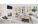 Relaxing living room features a cozy fireplace, comfortable seating, and large windows at 805 Pinehurst Dr, Chapel Hill, NC 27517