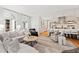 Open living area with comfortable seating, a neutral color palette, and access to the kitchen at 805 Pinehurst Dr, Chapel Hill, NC 27517