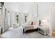 Spacious main bedroom with large windows and sitting area at 805 Pinehurst Dr, Chapel Hill, NC 27517