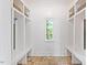 Bright mudroom with built-in benches and storage at 805 Pinehurst Dr, Chapel Hill, NC 27517
