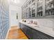Spacious pantry with gray cabinets and white countertops at 805 Pinehurst Dr, Chapel Hill, NC 27517