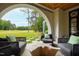 Relaxing patio with comfortable seating and a stunning golf course view at 805 Pinehurst Dr, Chapel Hill, NC 27517