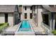 Stunning aerial view of a lap pool and spa, situated in a private backyard at 805 Pinehurst Dr, Chapel Hill, NC 27517