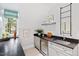 Wet bar with dark countertop and mini fridge at 805 Pinehurst Dr, Chapel Hill, NC 27517