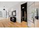 View of a wine room with glass door from the hallway at 805 Pinehurst Dr, Chapel Hill, NC 27517