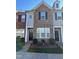 Brick front exterior of charming townhome with landscaping and pumpkin decor at 810 Bryant St, Raleigh, NC 27603