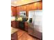 Modern kitchen with stainless steel appliances and dark wood cabinets at 810 Bryant St, Raleigh, NC 27603