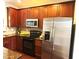 Modern kitchen with stainless steel appliances and dark wood cabinets at 810 Bryant St, Raleigh, NC 27603