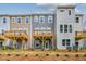 Rear view of townhouses with decks and landscaping at 833 Parc Townes Dr # 17, Wendell, NC 27591