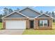 Two-car garage and front door at 858 Forth Ct, Gibsonville, NC 27249