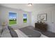 Bedroom featuring serene outdoor views and ample natural light from two large windows at Tbd Charlotte Knoll St # 13, Zebulon, NC 27597