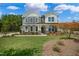 Two-story home featuring board and batten, stone accents, large windows, and a beautifully landscaped lawn at Tbd Charlotte Knoll St # 13, Zebulon, NC 27597