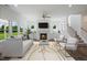 Bright living room features a fireplace, large windows, and a staircase at Tbd Charlotte Knoll St # 13, Zebulon, NC 27597