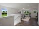 Spacious living room with hardwood floors, and plush gray sectional at Tbd Charlotte Knoll St # 13, Zebulon, NC 27597