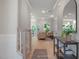 Welcoming foyer featuring hardwood floors, elegant decor, and seamless flow into the living area at 125 Charlotte Knoll St # 15, Zebulon, NC 27597