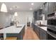Well-equipped kitchen featuring a large island, stainless steel appliances, and contemporary finishes at 125 Charlotte Knoll St # 15, Zebulon, NC 27597