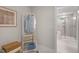 An open doorway leads to a spacious shower and a clothing rack next to a basket at 125 Charlotte Knoll St # 15, Zebulon, NC 27597