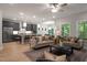 Open-concept living room and kitchen, with modern furnishings and plenty of natural light at 125 Charlotte Knoll St # 15, Zebulon, NC 27597