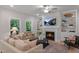 Inviting living room features a fireplace, built-in bookshelves, and a comfortable seating arrangement at 125 Charlotte Knoll St # 15, Zebulon, NC 27597