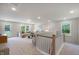 Spacious living room featuring plush seating, natural light, and neutral color palette at 125 Charlotte Knoll St # 15, Zebulon, NC 27597