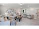Spacious living room featuring plush seating, natural light, and neutral color palette at 125 Charlotte Knoll St # 15, Zebulon, NC 27597