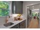 Butler's pantry includes gray cabinets, stainless steel sink, and lots of storage at 125 Charlotte Knoll St # 15, Zebulon, NC 27597