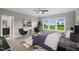 Well-lit bedroom with a large window, neutral color palette, and stylish decor for a cozy retreat at 116 Charlotte Knoll St # 7, Zebulon, NC 27597