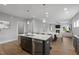 Modern kitchen with island and stainless steel appliances at 116 Charlotte Knoll St # 7, Zebulon, NC 27597