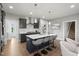 Stylish kitchen boasts a large island with seating, stainless steel appliances, and hardwood floors at 116 Charlotte Knoll St # 7, Zebulon, NC 27597