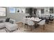 Open-concept living room with a dining area and kitchen featuring lots of natural light at 116 Charlotte Knoll St # 7, Zebulon, NC 27597