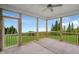 Spacious screened porch overlooking a lush green landscape at 116 Charlotte Knoll St # 7, Zebulon, NC 27597