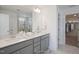 Double vanity bathroom with a walk-in shower and closet at Tbd Charlotte Knoll St # 8, Zebulon, NC 27597