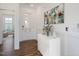 Bright entryway with hardwood floors, white console table, and art at 148 Charlotte Knoll St # 8, Zebulon, NC 27597