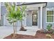 Modern front entrance with gray door and white columns at 148 Charlotte Knoll St # 8, Zebulon, NC 27597
