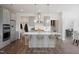 Open concept kitchen with large island and stainless steel appliances at 148 Charlotte Knoll St # 8, Zebulon, NC 27597