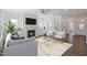 Living room with fireplace, hardwood floors, and large windows at 148 Charlotte Knoll St # 8, Zebulon, NC 27597