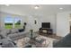 Open living area with comfy seating and a large TV at 148 Charlotte Knoll St # 8, Zebulon, NC 27597
