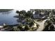 Aerial view of a lakefront community with clubhouse, pool, and parking at 178 Charlotte Knoll St # 9, Zebulon, NC 27597