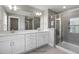 Elegant bathroom with double vanity, large mirror, and a walk-in shower at 178 Charlotte Knoll St # 9, Zebulon, NC 27597