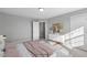 Well-lit bedroom with two windows offering open views at 178 Charlotte Knoll St # 9, Zebulon, NC 27597