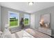 Spacious bedroom with two windows and a view of greenery at 178 Charlotte Knoll St # 9, Zebulon, NC 27597