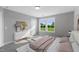 Bright bedroom with large windows and ample natural light at 178 Charlotte Knoll St # 9, Zebulon, NC 27597