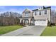 Two-story home with gray siding, white trim, and a two-car garage at 178 Charlotte Knoll St # 9, Zebulon, NC 27597