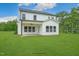 Two story house with a covered patio and grassy backyard at 178 Charlotte Knoll St # 9, Zebulon, NC 27597
