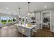 Modern kitchen with island, stainless steel appliances, and eat-in area at 178 Charlotte Knoll St # 9, Zebulon, NC 27597