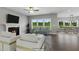 Open living room with hardwood floors and view to dining area at 178 Charlotte Knoll St # 9, Zebulon, NC 27597