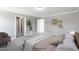 Main bedroom with large bed, plush carpet, and sitting area at 178 Charlotte Knoll St # 9, Zebulon, NC 27597