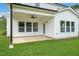 Covered patio with ceiling fan and grassy backyard at 178 Charlotte Knoll St # 9, Zebulon, NC 27597